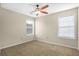 Well-lit bedroom with neutral walls and carpet flooring at 1014 Ariel Ct, Summerville, SC 29485