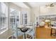 Charming dining area with a round table and chairs near a sunlit window at 1014 Ariel Ct, Summerville, SC 29485
