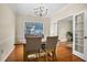 Dining room with hardwood floors, chandelier, and French doors at 1014 Ariel Ct, Summerville, SC 29485