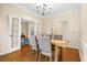 Bright dining room with hardwood floors and access to other rooms at 1014 Ariel Ct, Summerville, SC 29485