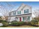 Two-story house with white siding, green shutters, and a red front door at 1014 Ariel Ct, Summerville, SC 29485