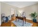 Home office with hardwood floors, desk, and view to dining room at 1014 Ariel Ct, Summerville, SC 29485