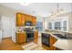 Bright kitchen with wood cabinets, stainless steel appliances, and an island at 1014 Ariel Ct, Summerville, SC 29485