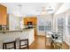 Kitchen with breakfast bar, wood cabinets, and a view to the Gathering room at 1014 Ariel Ct, Summerville, SC 29485