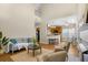 Open concept living room with high ceilings, fireplace and access to the kitchen and dining area at 1014 Ariel Ct, Summerville, SC 29485