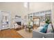 Living room featuring hardwood floors, fireplace, built-in shelving, and a view to the backyard at 1014 Ariel Ct, Summerville, SC 29485
