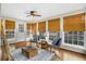 Spacious sunroom with multiple windows and wooden floors at 1014 Ariel Ct, Summerville, SC 29485
