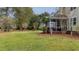 Screened porch and expansive grassy backyard at 113 History Ln, Summerville, SC 29485