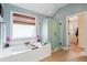 Relaxing bathroom with soaking tub, walk-in shower, and updated fixtures at 113 History Ln, Summerville, SC 29485