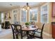Bright breakfast nook features a round table and four chairs, perfect for enjoying morning meals at 113 History Ln, Summerville, SC 29485
