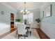 Bright dining room with hardwood floors, chandelier, and seating for six at 113 History Ln, Summerville, SC 29485