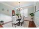Bright dining room with hardwood floors, chandelier, and seating for six at 113 History Ln, Summerville, SC 29485