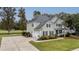 Two-story house with a three-car garage and a long driveway at 113 History Ln, Summerville, SC 29485