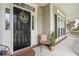 Inviting front porch with black door and stylish seating at 113 History Ln, Summerville, SC 29485