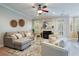 Spacious Gathering room with comfortable seating, fireplace, and access to patio at 113 History Ln, Summerville, SC 29485