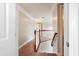 Upstairs hallway with carpeted floors and wooden railing at 113 History Ln, Summerville, SC 29485