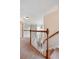 Upper hallway showcasing carpeted floors and wooden railings at 113 History Ln, Summerville, SC 29485