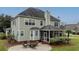 Patio with fire pit and seating area, adjacent to screened porch at 113 History Ln, Summerville, SC 29485