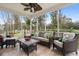Relaxing screened porch with wicker furniture and view of the backyard at 113 History Ln, Summerville, SC 29485