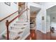 Elegant staircase with wooden railing and carpet at 113 History Ln, Summerville, SC 29485