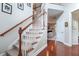 Elegant staircase with wooden railing and carpet at 113 History Ln, Summerville, SC 29485