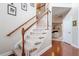 Elegant staircase with wooden railing and carpet at 113 History Ln, Summerville, SC 29485