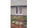 Back exterior with double doors and patio at 1150 King St, Charleston, SC 29403