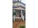 Two-story house with front porch and steps at 1150 King St, Charleston, SC 29403