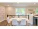 Modern dining area with white table and chairs, located near kitchen at 120 Cuthbert Dr, Goose Creek, SC 29445