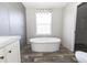 Bathroom with a large soaking tub and window at 120 Wilder Rd, Saint Stephen, SC 29479