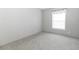 Simple bedroom featuring carpeted floors and a window with blinds at 120 Wilder Rd, Saint Stephen, SC 29479