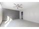 Bright bedroom with ceiling fan and access to bathroom at 120 Wilder Rd, Saint Stephen, SC 29479
