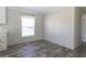 Simple dining area with wood-look floors and a window with blinds at 120 Wilder Rd, Saint Stephen, SC 29479