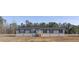 Newly constructed manufactured home with gray siding and black shutters at 120 Wilder Rd, Saint Stephen, SC 29479
