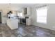 Modern kitchen with white cabinets, stainless steel appliances, and marble countertops at 120 Wilder Rd, Saint Stephen, SC 29479