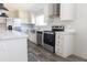 Modern kitchen with white cabinets, stainless steel appliances, and marble countertops at 120 Wilder Rd, Saint Stephen, SC 29479