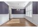 Bright dining room features hardwood floors, wainscoting, and plantation shutters at 1212 Topside Dr, Charleston, SC 29414