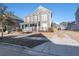 Two-story house with gray siding, front porch, and driveway at 1212 Topside Dr, Charleston, SC 29414