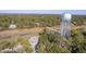 Aerial view of a neighborhood with marsh and water tower at 1248 Creek Watch Trce, Seabrook Island, SC 29455