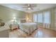 Charming bedroom with light green walls, hardwood floors, and a comfortable bed at 1248 Creek Watch Trce, Seabrook Island, SC 29455