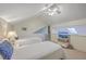 Bedroom with two twin beds, TV, and a ceiling fan at 1248 Creek Watch Trce, Seabrook Island, SC 29455