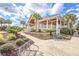 Community clubhouse featuring a porch and landscaping at 1248 Creek Watch Trce, Seabrook Island, SC 29455
