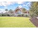 Community clubhouse with expansive lawn and palm trees at 1248 Creek Watch Trce, Seabrook Island, SC 29455