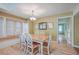 Bright dining room with wood floors and built-in window seat at 1248 Creek Watch Trce, Seabrook Island, SC 29455