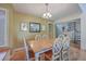 Charming dining room featuring a wood table and spiral staircase view at 1248 Creek Watch Trce, Seabrook Island, SC 29455