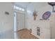 Bright entryway with tiled floor, spiral staircase, and storage cabinet at 1248 Creek Watch Trce, Seabrook Island, SC 29455