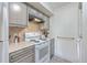 White and gray kitchen with stove and built-in microwave at 1248 Creek Watch Trce, Seabrook Island, SC 29455