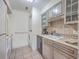 Galley kitchen with white appliances and tile floors at 1248 Creek Watch Trce, Seabrook Island, SC 29455