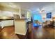 Open concept kitchen with island, stainless steel appliances, and hardwood floors at 1300 Park West Blvd # 1109, Mount Pleasant, SC 29466