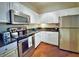 Modern kitchen with stainless steel appliances and dark countertops at 1300 Park West Blvd # 1109, Mount Pleasant, SC 29466
